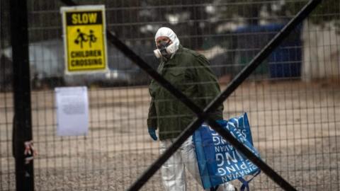 Man wearing a protective suit at Malakasa camp. Greece (05/04/20)