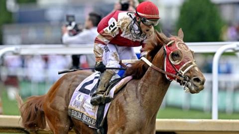 Sonny Leon aboard Rich Strike celebrates winning the 148th running of the Kentucky Derby at Churchill Downs