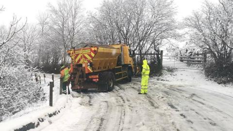 A gritter blocking the road