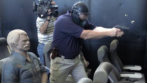 A firearm instructor teaching pilots in Artesia in October 2003