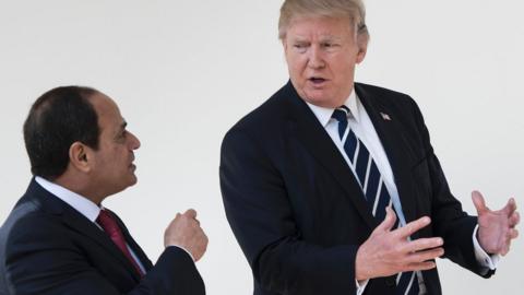 Egypt"s President Abdel Fattah al-Sisi (L) and US President Donald Trump walk through the colonnade of the White House to a lunch after a meeting on April 3, 2017 in Washington, DC