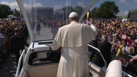 The pope greets crowds in Romania