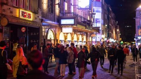 People gather outside G-A-Y nightclub following the 10pm curfew