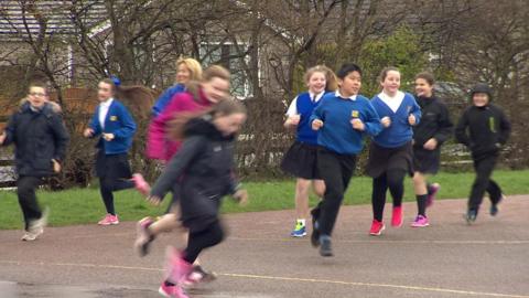 School children running