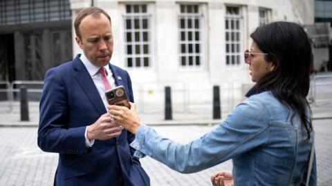 Gina Coladangelo shows Matt Hancock a phone