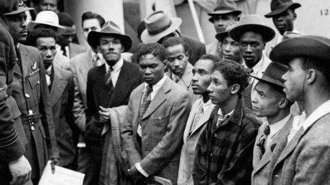Jamaican immigrants arrive in Britain on Empire Windrush at Tilbury, around 1948