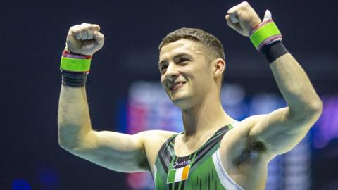 Rhys McClenaghan celebrates after winning pommel horse gold at the World Championships in Liverpool last November