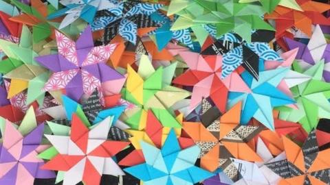 A pile of colourful origami stars