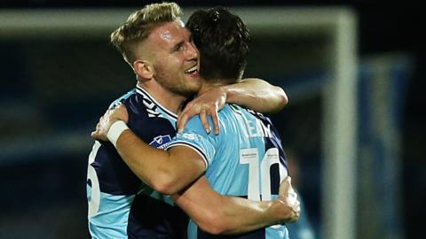 Jason McCarthy and Luke Leahy celebrate Wycombe's second goal