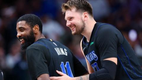 Kyrie Irving and Luka Doncic celebrate