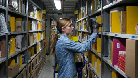 woman in Amazon warehouse