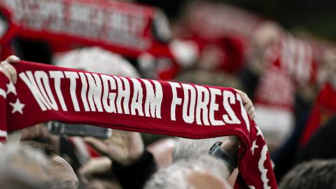 Nottingham Forest scarf being held up by a fan