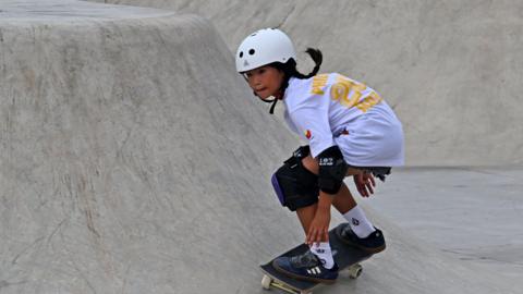 Philippines skateboarder Mazel Alegado, aged nine, competes in the women's park final at the 2023 Asian Games