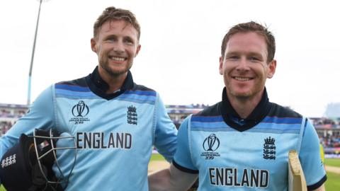 England batsmen Joe Root (left) and Eoin Morgan (right) embrace and smile as they walk off the pitch after beating Australia in the World Cup semi-final