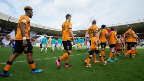 Players walk out before a Championship match