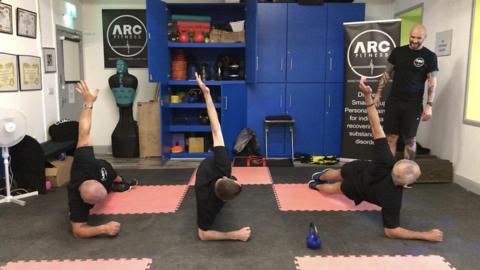 ARC Fitness clients planking