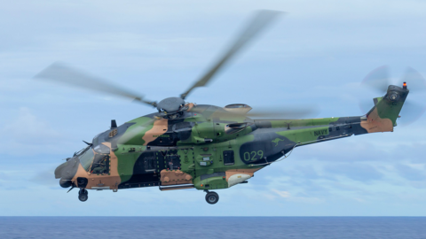 A handout file photo made available on 29 July 2023 by the Australian Defence Force (ADF) shows an Australian Army MRH-90 Taipan helicopter conducting flying serials during a ship's transit to Vanuatu, 23 July 2020