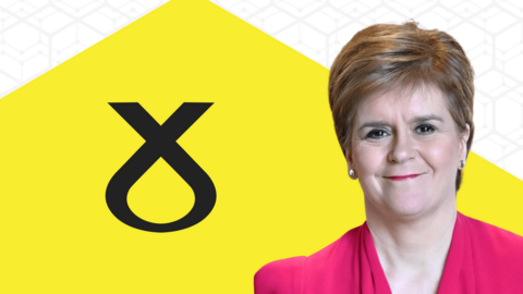 Leader Nicola Sturgeon appears in front of SNP banner