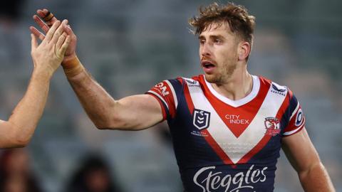 Paul Momirovski shakes Luke Keary's hand