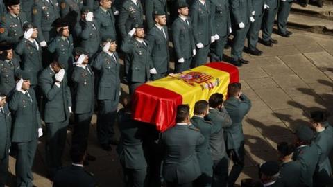 Guardia Civil officers carry the coffin of their colleague David Perez Carracedo in Pamplona, northern Spain