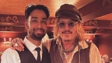 Johnny Depp with member of staff