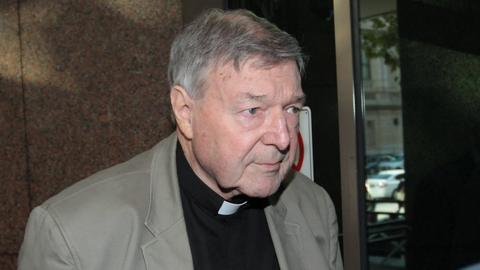 Cardinal George Pell arrives for the court hearing in Melbourne