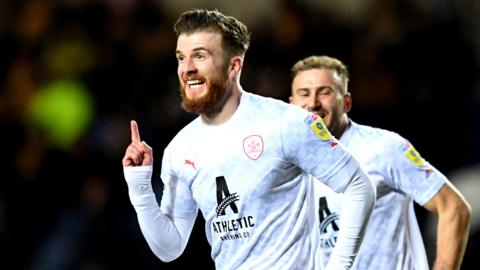 Barnsley's Nicky Cadden celebrates scoring at Oxford