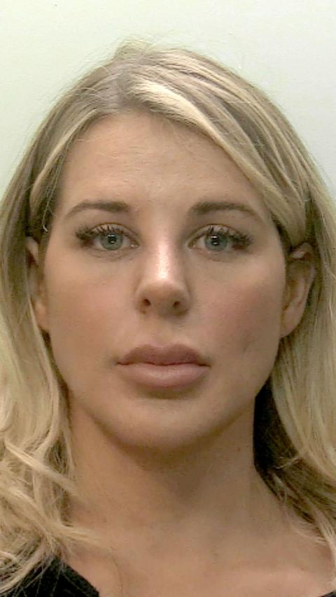 Mug shot of a woman with blonde hair