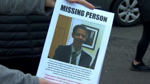 A missing person poster with Noah Donohoe's face on it 