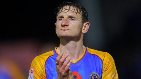 Shrewsbury Town defender Will Boyle applauds supporters