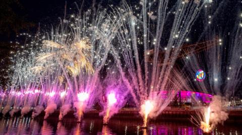 purple and gold fireworks over the river clyde
