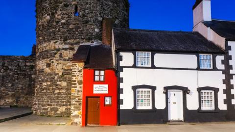 eye-catching red exterior, the Smallest House in Great Britain is hard to miss