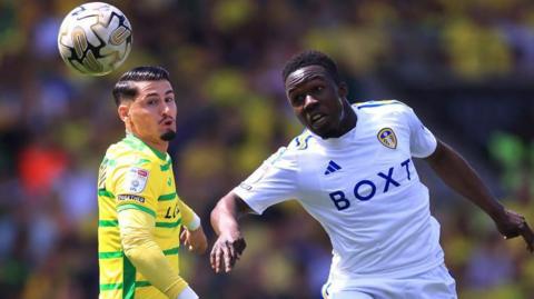 Borja Sainz of Norwich City and Wilfried Gnonto of Leeds United battle for the ball during the Sky Bet Championship Play-Off Semi-Final 1st Leg match between Norwich City and Leeds United at Carrow Road on May 12, 2024 in Norwich, England.