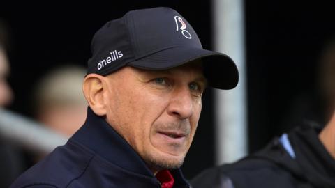 Gerhard Struber looking on while sat in the dugout
