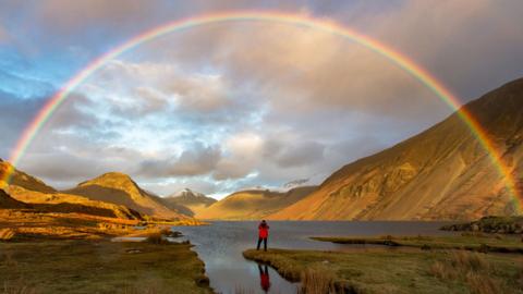 Rainbow at an hilly landscape