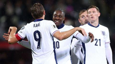 Kane and Eze celebrate