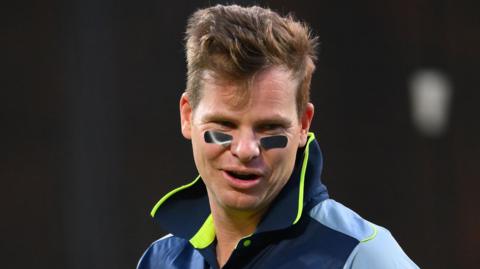 Steve Smith with black tape under his eyes