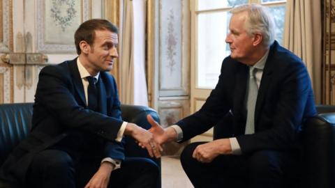 French president Emmanuel Macron (L) shakes hands with European Commission Chief Negotiator Michel Barnier prior to their meeting at the Elysee palace in Paris, on January 31, 2020