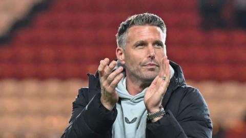 Rob Edwards clapping Middlesbrough supporters at the end of their 2-1 victory over Ipswich 