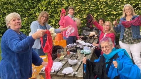 SI Salisbury women sorting through the bras last summer 