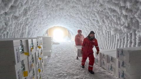 Scientists store boxes of ice core inside a cave on the Antarctic continent