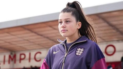 Maddy Earl in England training top