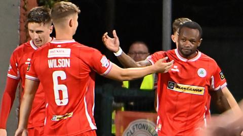 Eric McWoods celebrates scoring