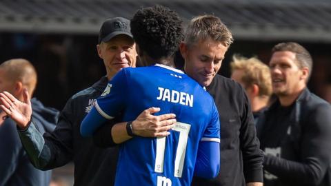 Ipswich Town boss Kieran McKenna embracing winger Jaden Philogene