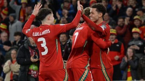 Wales celebrate a goal against Finland