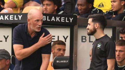 Norwich City boss Philippe Clement remonstrates with a match official during a match.