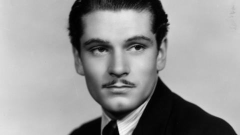 Sir Laurence Olivier, pictured as a young man with a moustache