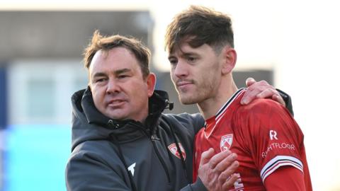 Derek Adams and Ben Tollitt celebrate a first win of the league campaign