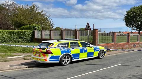 Police car and police tape