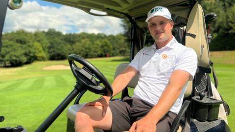 Kipp Poppert sat in his golf buggy on the green at Wildernesse Golf Club in Kent.